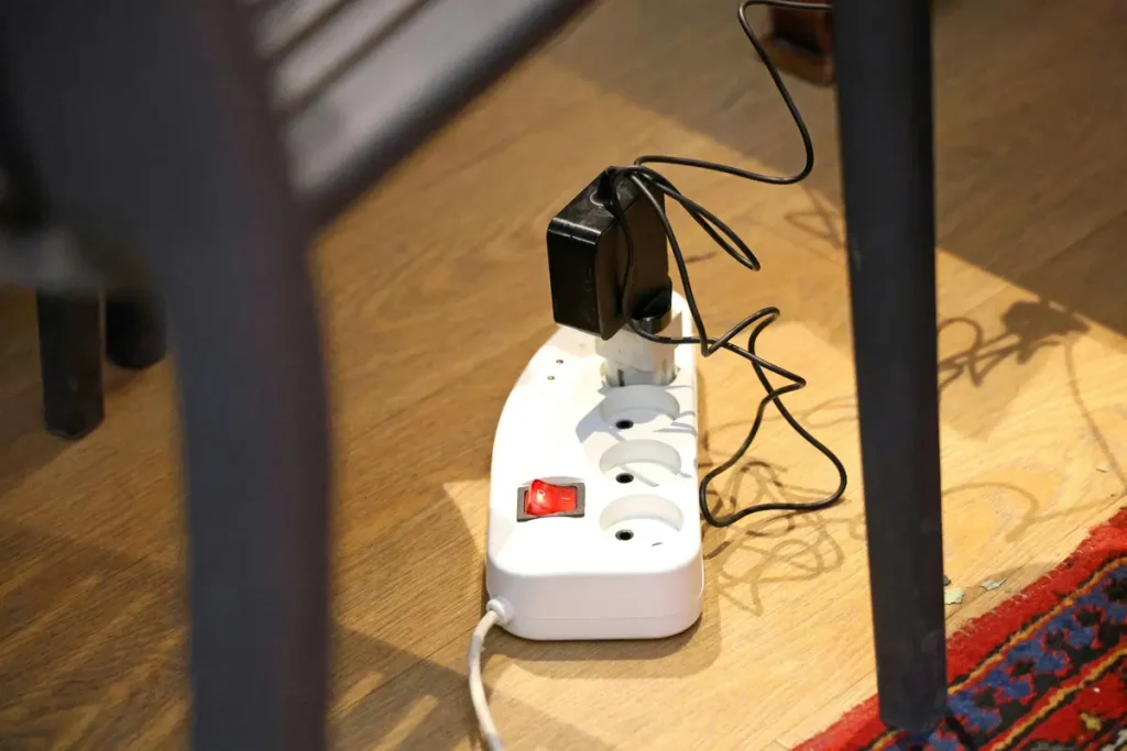 Homeowner checking appliances that may be wasting electricity