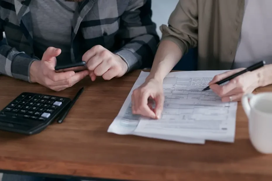 Couple reviewing household bills and ways to lower their electric bill